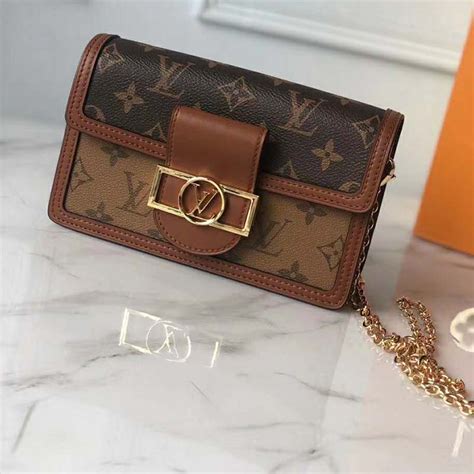 louis vuitton dauphine chain wallet.